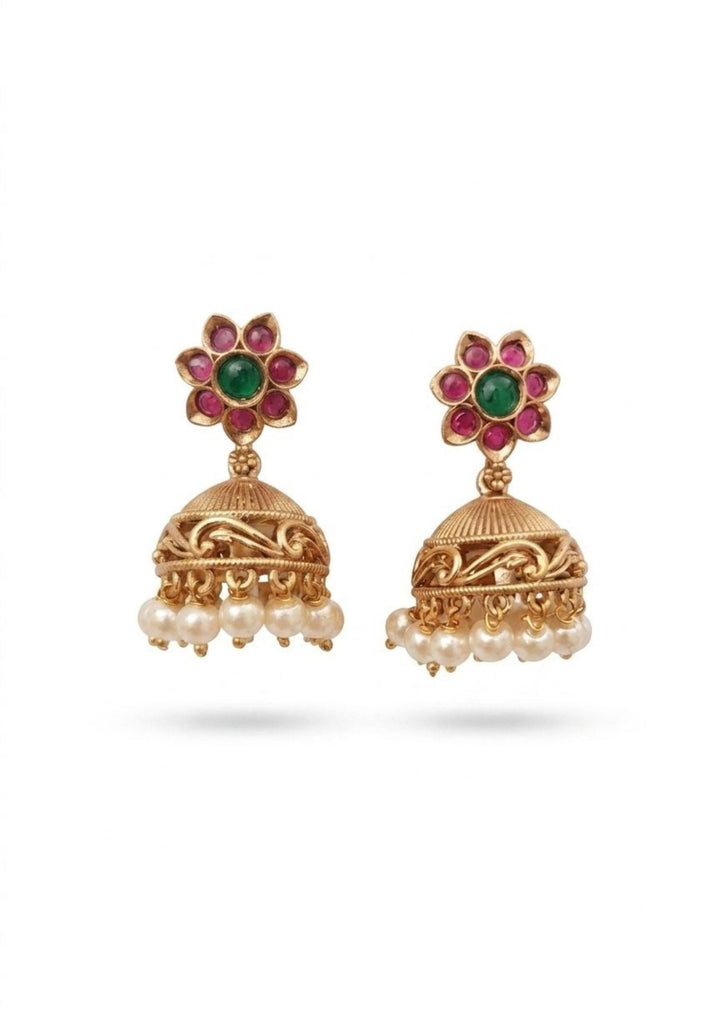 Gold jhumkas earrings with floral designs and pearl drops on a white background shows very classy look and can be used for functional ware, festive ware and can gift 