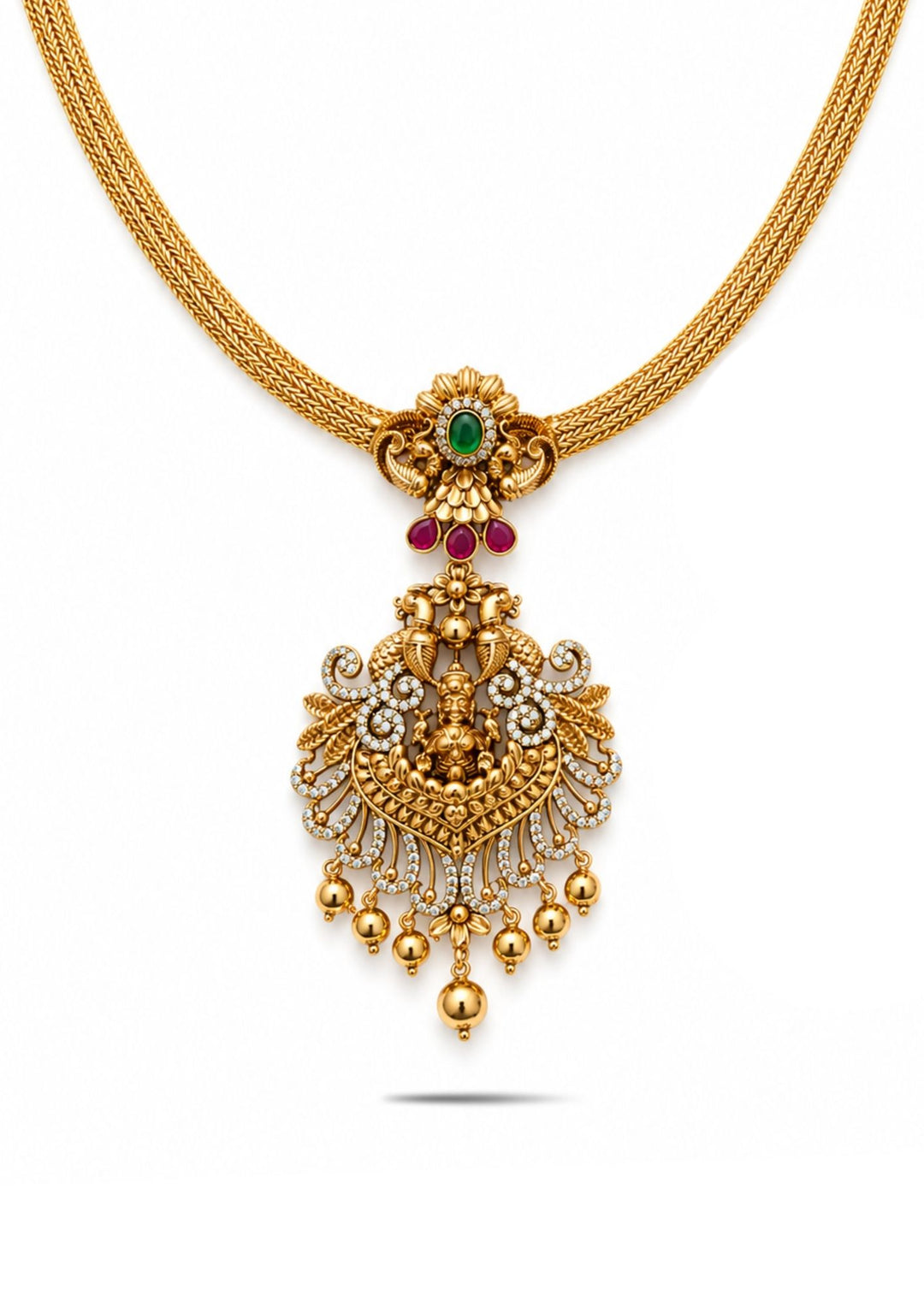 Laxmi Devi Gold Plated temple necklace chain designed with smooth layered chain pattern and traditional pendant with Goddess Laxmi carving, floral motifs, green center stone detailing, sparkling white zircon stones, and simple gold beadsam hangings. The necklace is finished in rich antique gold plating that gives a royal South Indian ethnic jewelry look. This lightweight necklace comes with sweat proof quality, anti-fade colour, skin-friendly finish, smooth fitting, and is suitable for weddings, 
