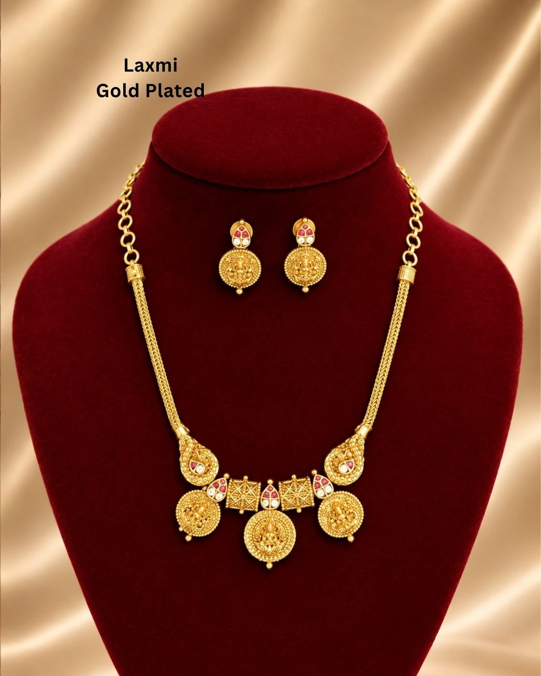 Traditional gold plated designer necklace and earrings set featuring multiple Goddess Lakshmi coin motifs, intricate temple-inspired detailing, ruby-colored stone accents, and matching decorative earrings, perfect for festive, wedding, and traditional occasions.