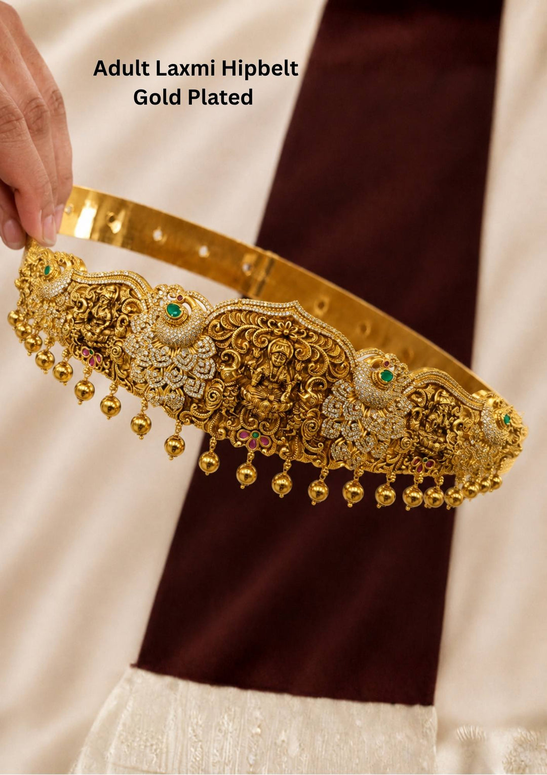 Gold-plated Emerald Laxmi hipbelt shown clearly with beads and also with peacock design comes with traditiona look and it will be sikn safe no rashes and also used for festivals and weeding's and bridal 