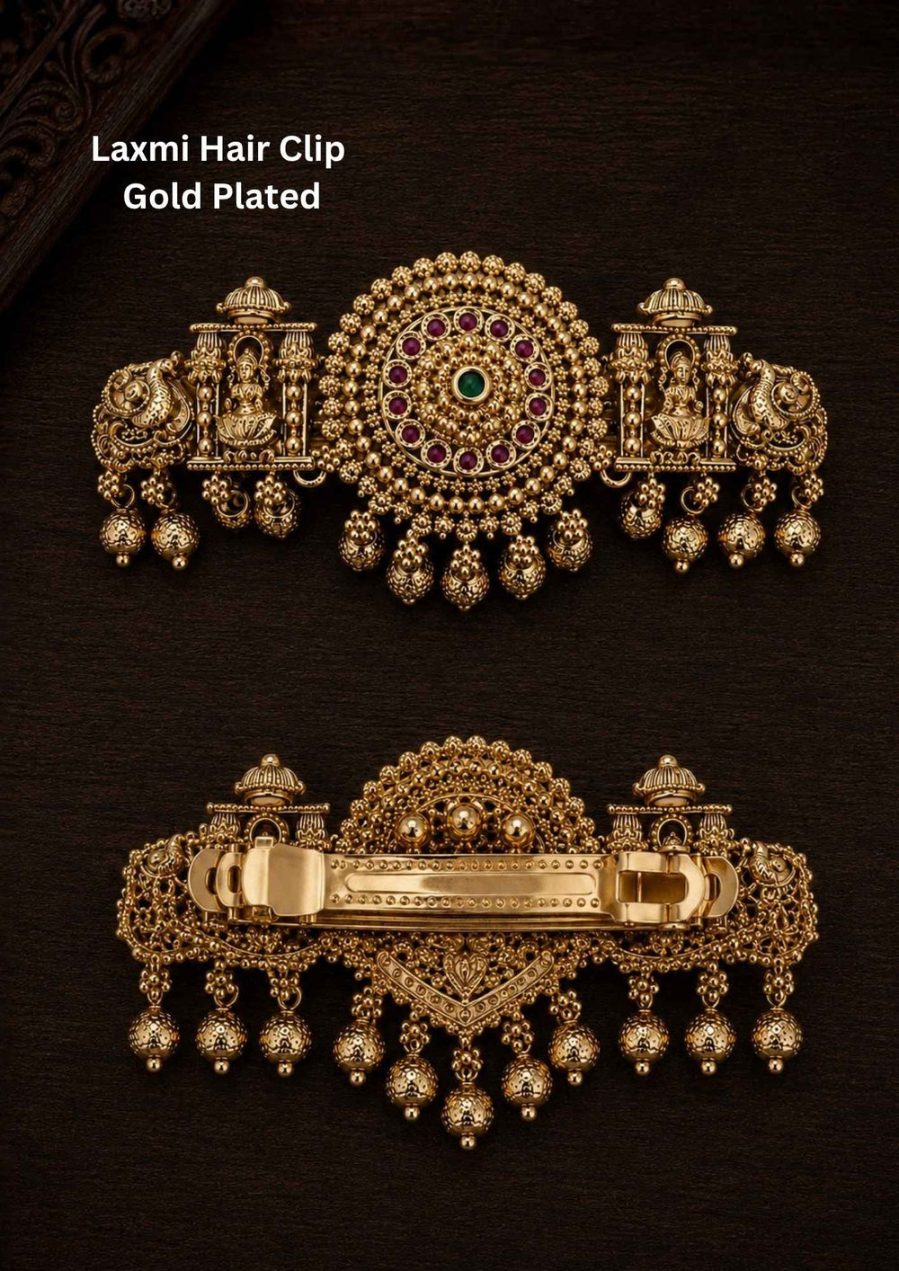 Gold plated Laxmi hair clip with antique finish, designed with Lord Lakshmi in sitting in a temple, peacocks, circle designed by ruby pink and green stone with hanging gold bead drops in South Indian temple jewelry pattern perfect for bridal hairstyles, Bharatanatyam, weddings, festivals, poojas, sarees, lehengas, and traditional ethnic hair styling with rich royal appearance.