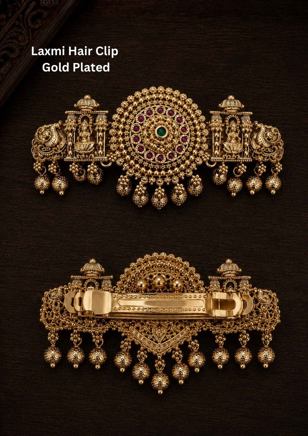 Gold plated Laxmi hair clip with antique finish, designed with Lord Lakshmi in sitting in a temple, peacocks, circle designed by ruby pink and green stone with hanging gold bead drops in South Indian temple jewelry pattern perfect for bridal hairstyles, Bharatanatyam, weddings, festivals, poojas, sarees, lehengas, and traditional ethnic hair styling with rich royal appearance.