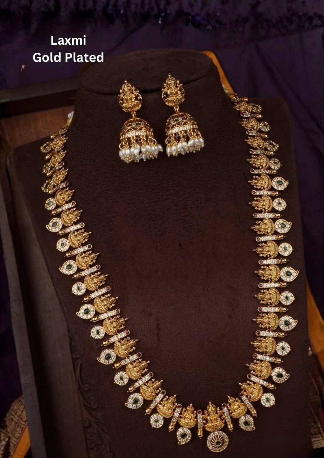 gold plated Laxmi mango design and light weight earrings and can look very clearly and comes with emerald stones and can use for festivals and weeding's 