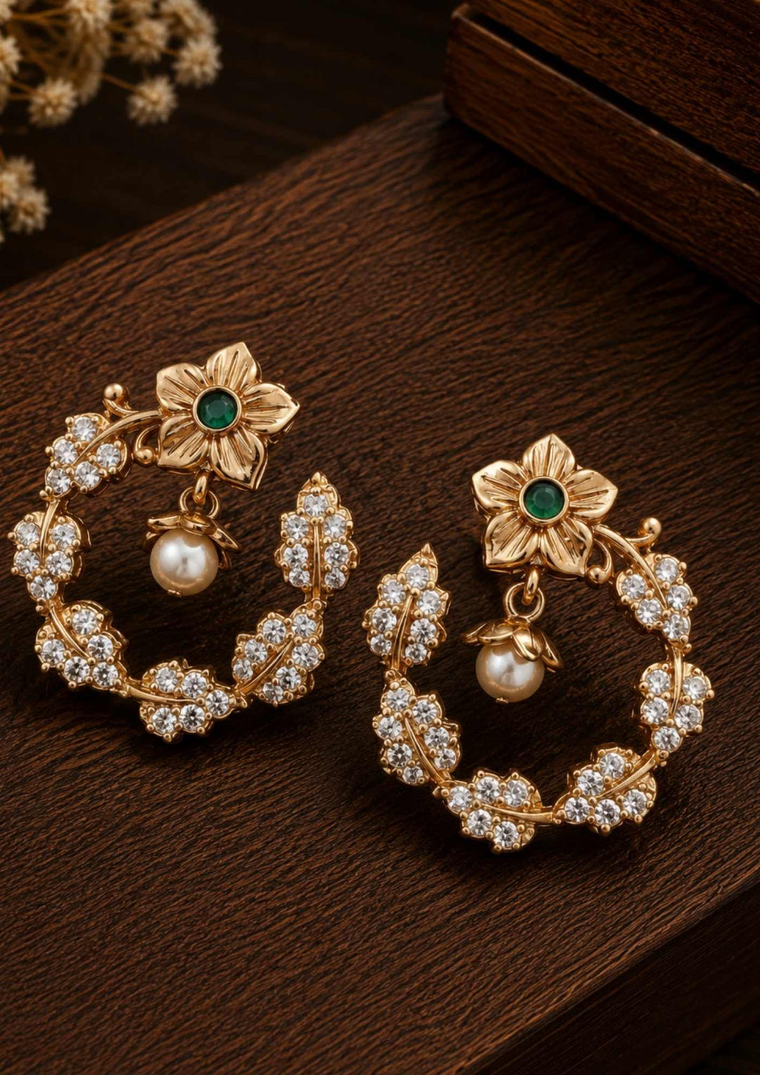 This is a simple and delicate Zircon Diamond Mangalsutra Set with matching earrings. It features a modern, lightweight look designed for everyday wear. The style blends the traditional protective black beads with trendy hanging charms. Instead of a single heavy pendant, the front half of the necklace features a row of dangling charms. Each charm is a square-cut, bright white zircon stone held in a secure gold prong setting. These little diamond charms hang freely and catch the light smoothly.
