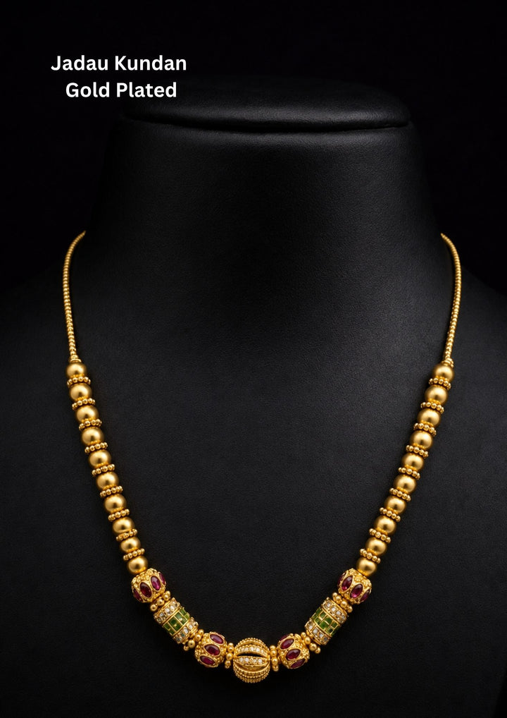 Gold-plated necklace with gemstones Gold-plated necklace with intricate design necklace and with green and red stones come with jadau kundan in necklace with beads and in pendent shows clear design and in detailed shown in picture it will not fade color and water proof can used for festivals, bridals, and weeding&