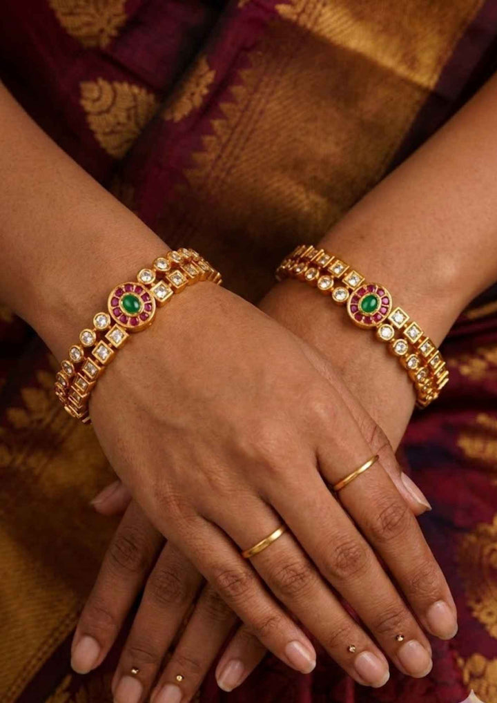 traditional women wearing a Panchaloham  bangles with shine and good looking and used for  functional , festivals and gifting