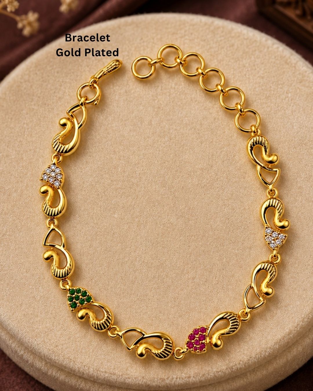 Stylish gold plated peacock design bracelet featuring intricate traditional motifs, vibrant green and ruby stone accents, sparkling white detailing, and an elegant linked pattern. Perfect for festive occasions, traditional outfits, weddings, parties, and special events.