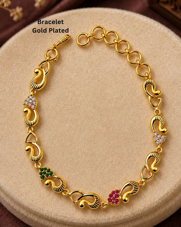 Stylish gold plated peacock design bracelet featuring intricate traditional motifs, vibrant green and ruby stone accents, sparkling white detailing, and an elegant linked pattern. Perfect for festive occasions, traditional outfits, weddings, parties, and special events.