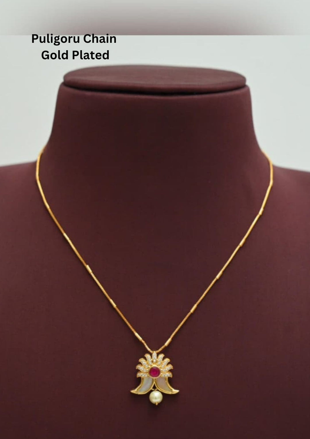 gold plated puligoru chain comes with pearl drop and rudy stone in pendent and show picture clearly how it looks and anti faded and skin safe and can be used for weeding's , festivals 