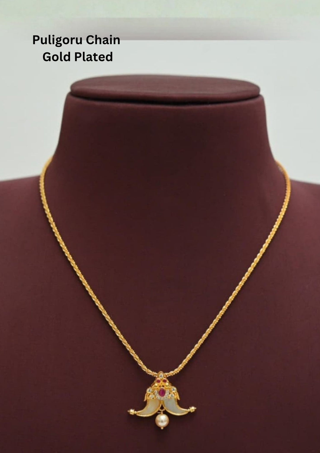gold plated puligoru chain comes with pearl drop and rudy stone in pendent and show picture clearly how it looks and anti faded and skin safe and can be used for weeding's , festivals 