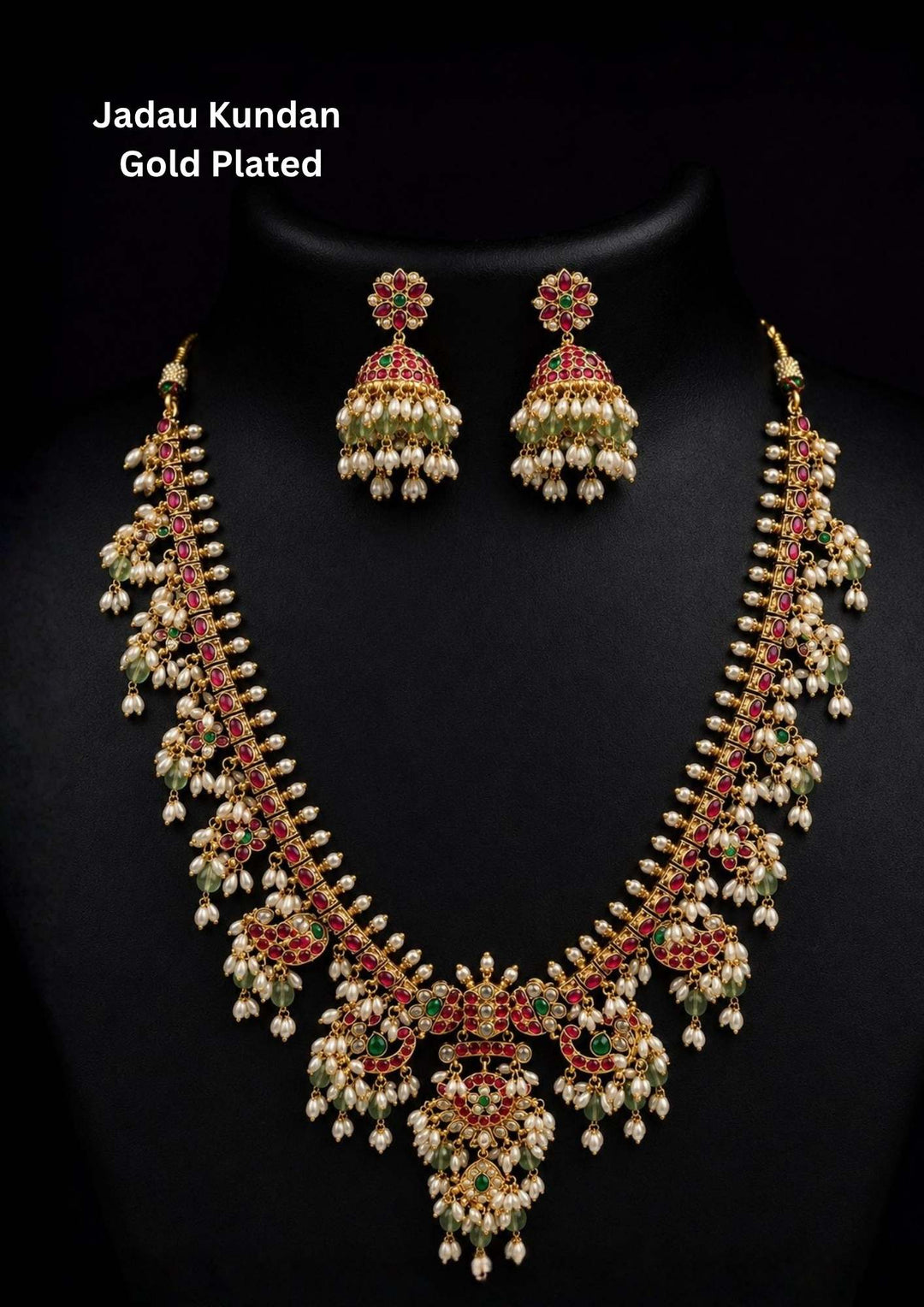 Gold-plated necklace set with intricate design long necklace Set and earrings  with rice beads green and red stones come with jadau kundan in necklace set  with beads and in pendent and earrings shows clear design and in detailed shown in picture it will not fade color and water proof can used for festivals, bridals, and weeding's  