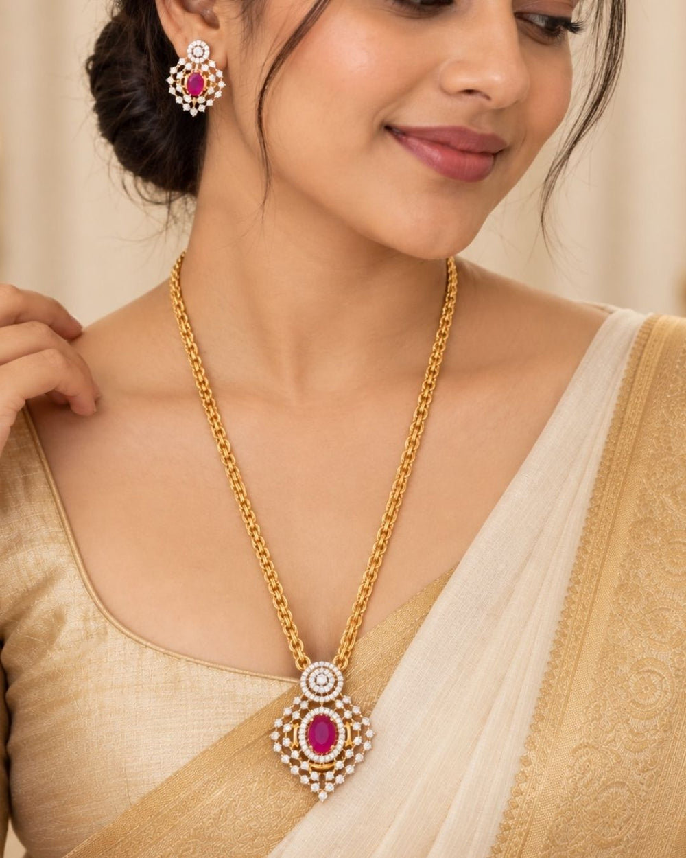 Designer gold plated necklace set featuring a layered chain, intricate zircon detailing, pink gemstone accents, and matching earrings, perfect for festive and traditional wear.