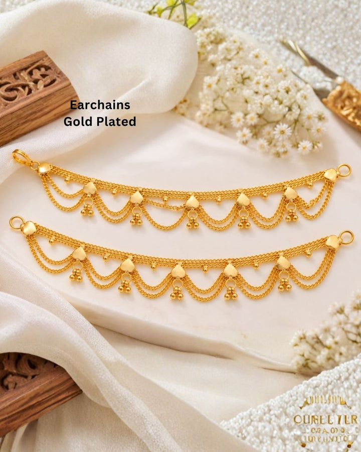 Gold plated traditional ear chains featuring multiple layered chain loops, decorative heart-shaped links, and tiny gold bead drops.