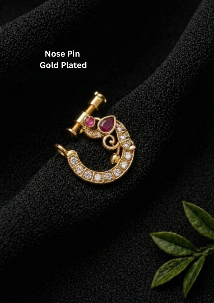 Gold-plated nose pin with gemstones show very clearly how it look and nose pins are indian traditions to women can be used for weeding's , bridals and festivals and anti faded sweat proof 