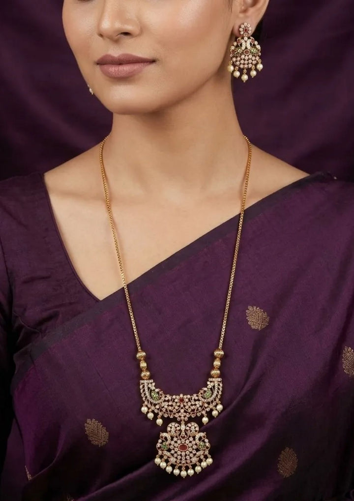 close-up of south indian women wearing Gold Plated Zircon Diamond necklace and earring set showing the fine leaf link pattern and smooth pearl charms. This lightweight, sweat-proof jewelry piece offers an anti-fade, high-shine finish perfect for weddings, parties, and festive occasions.