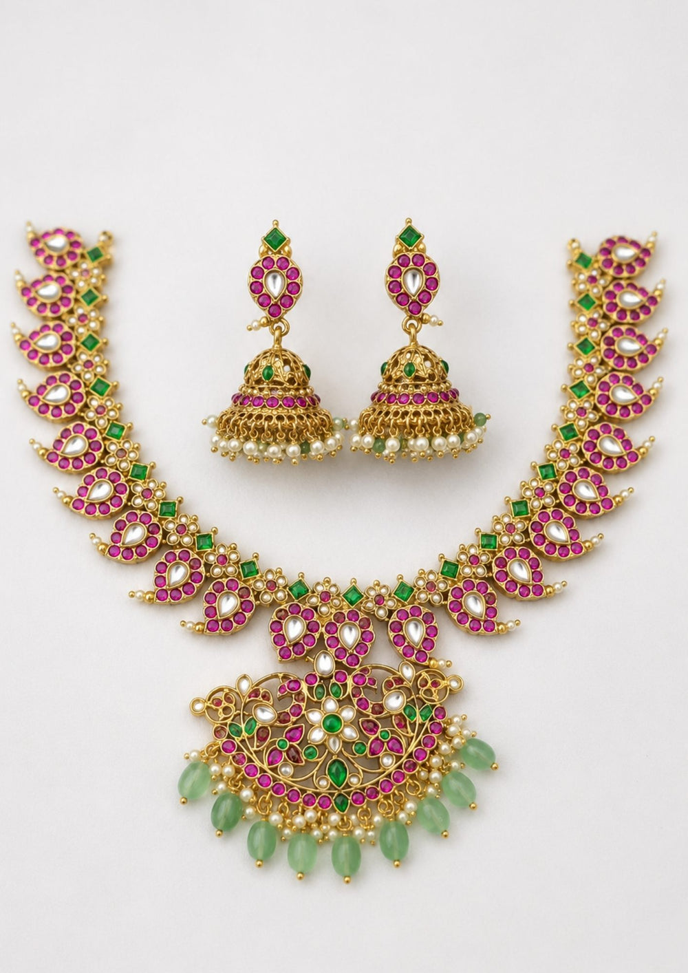 Jadau Kundan gold plated beads mango design necklace set in white background with waterproof, anti fade used for weddings, festivals and ideal for gifting. 