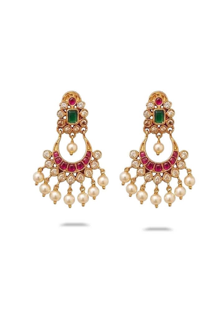 Ornate earrings with gemstones and pearls on a white background earrings shows very clear with chandbali design 