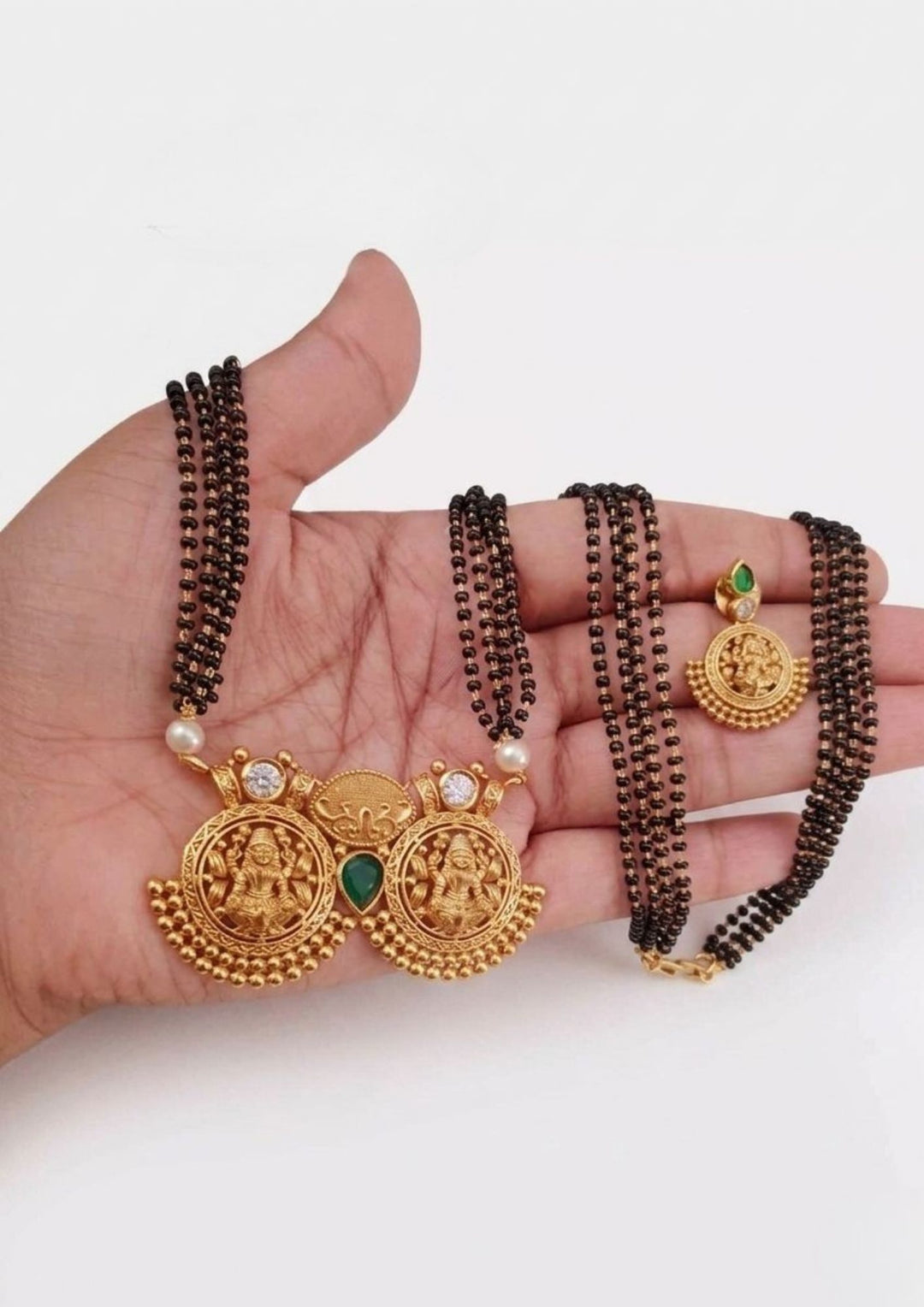 gold plated  laxmi devi mangalsutra  white background flat detail for functional, festive , south indian festivals