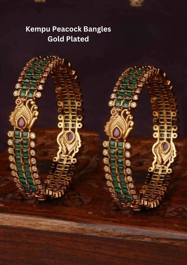 Gold Plated Kempu Bangles with traditional South Indian temple jewelry design with red and green kempu stones arranged in detailed floral and leaf patterns. The bangles come with rich gold plated finish, traditional detailing, lightweight feel, sweat proof quality, anti-fade colour, skin-friendly finish, and comfortable fit perfect for bridal wear, weddings, pooja functions, festivals, and traditional occasions.