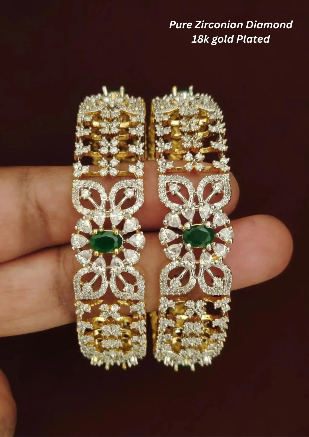 Gold and diamond bangles with green gemstones