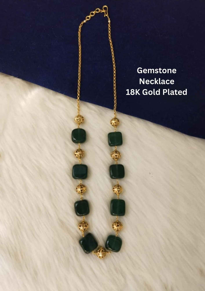 Gold and green gemstone necklace