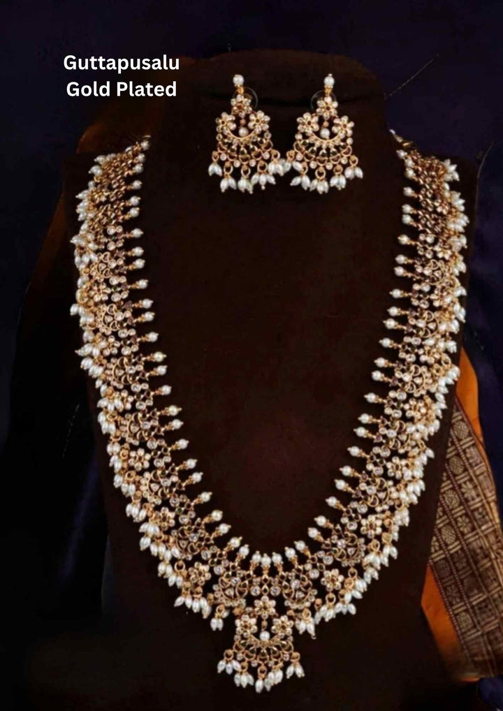 Gold and pearl jewelry set with Guttapusalu rice beads model haram with traditional look and south indian women wore for functional, festival and for gifting  the haram set 