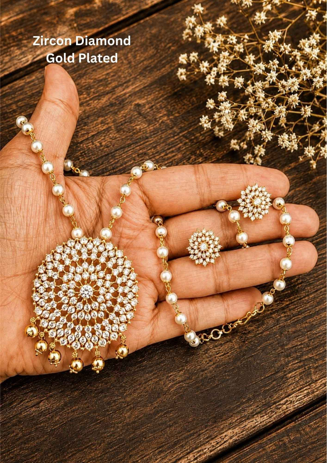 The jewelry set shown is a white cubic zirconia and pearl beaded pendant necklace set, typically consisting of a necklace and a pair of matching stud earrings. This style is often gold-plated and designed as a traditional or ethnic statement piece suitable for weddings, festivals, and special occasions.