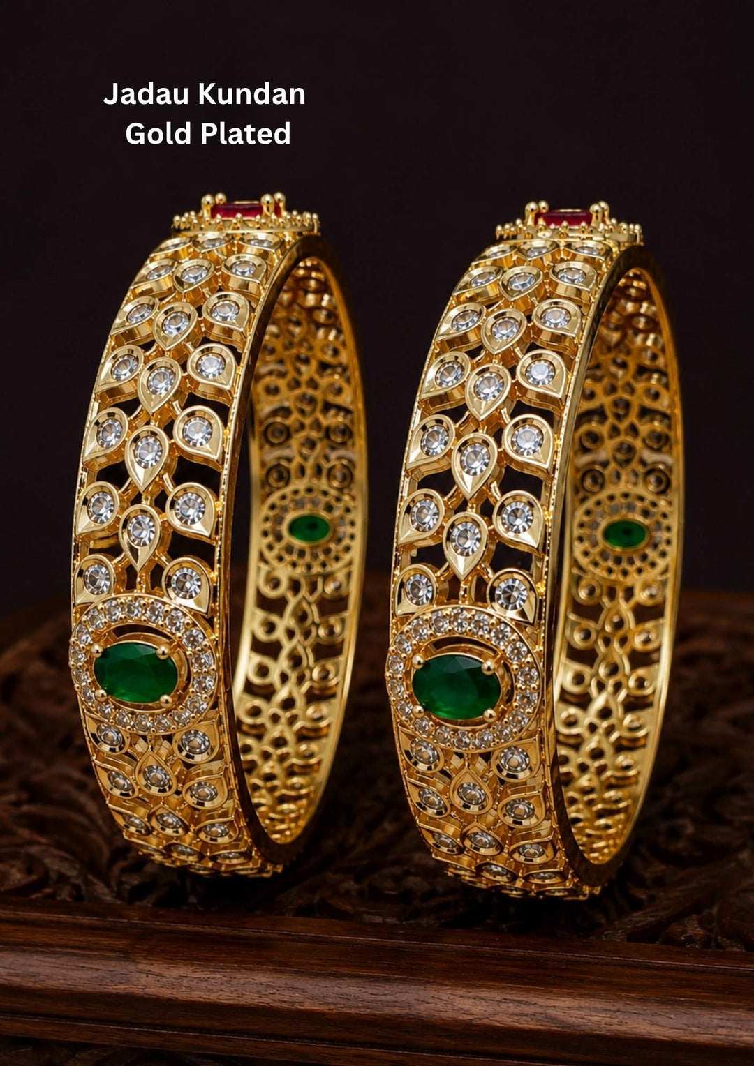 Beautiful Jadau Kundan gold plated openwork bangle pair featuring dazzling white kundan stones, emerald green center stones, and intricate traditional craftsmanship. Perfect for weddings, festivals, temple visits, traditional outfits, family functions, and premium gifting.