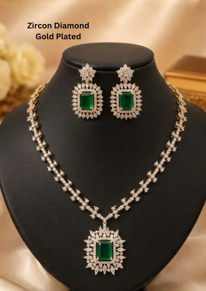 Gold-plated zircon diamond jewelry set featuring a necklace and matching drop earrings displayed. The set features rectangular green emerald-cut stones surrounded by sparkling clear stones in silver-toned settings. Lightweight and perfect for weddings, parties, festive occasions, and special celebrations.