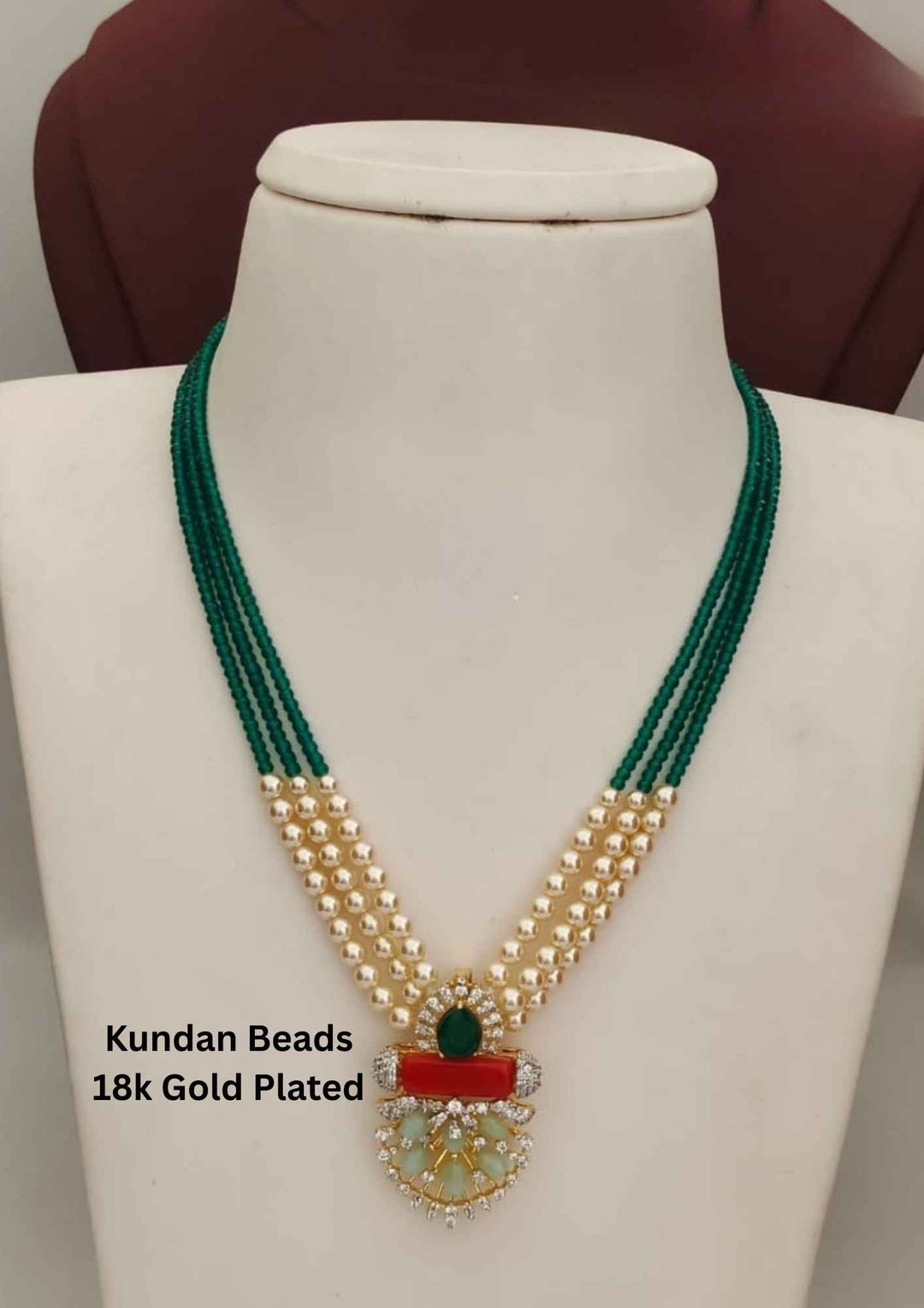 Green beaded necklace with gold plating