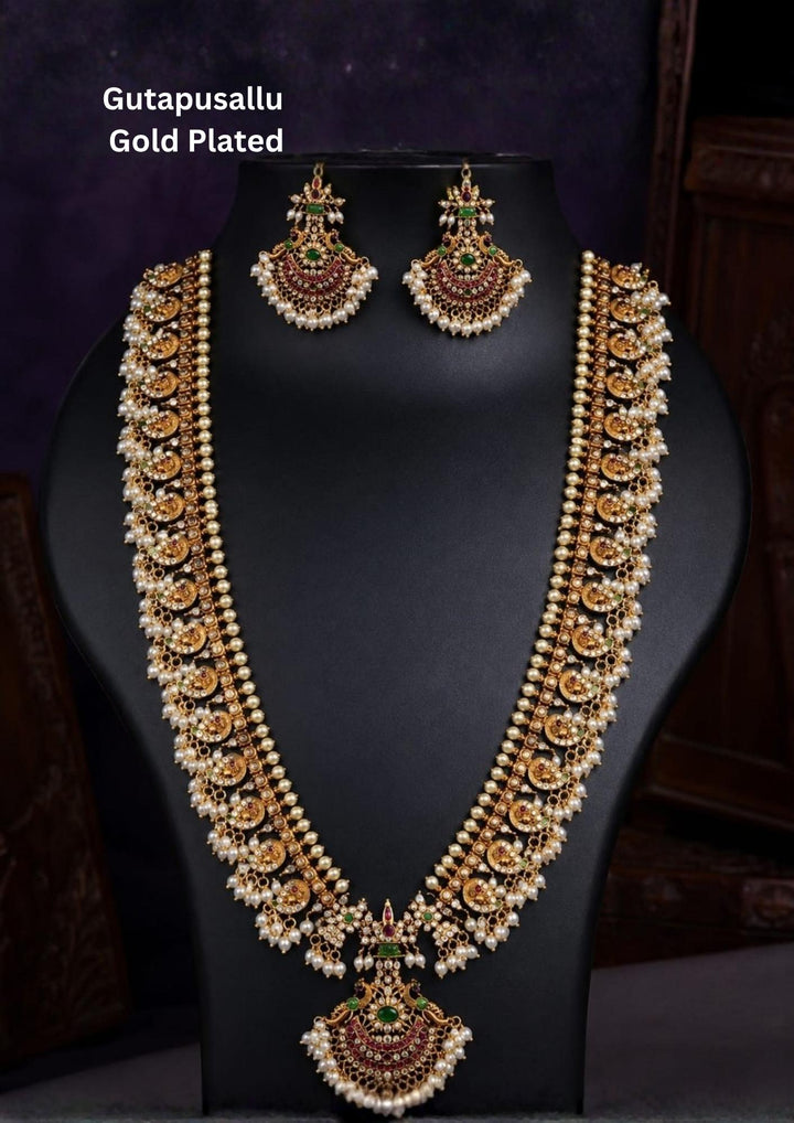it is designed with in mango motifs and one row pearl tear drops, gold beads chain with rice beads at the end and comes with matching earrings, perfect for weddings, poojas, temple functions, Bharatanatyam, sarees, lehengas, and traditional ethnic wear with royal gold look.