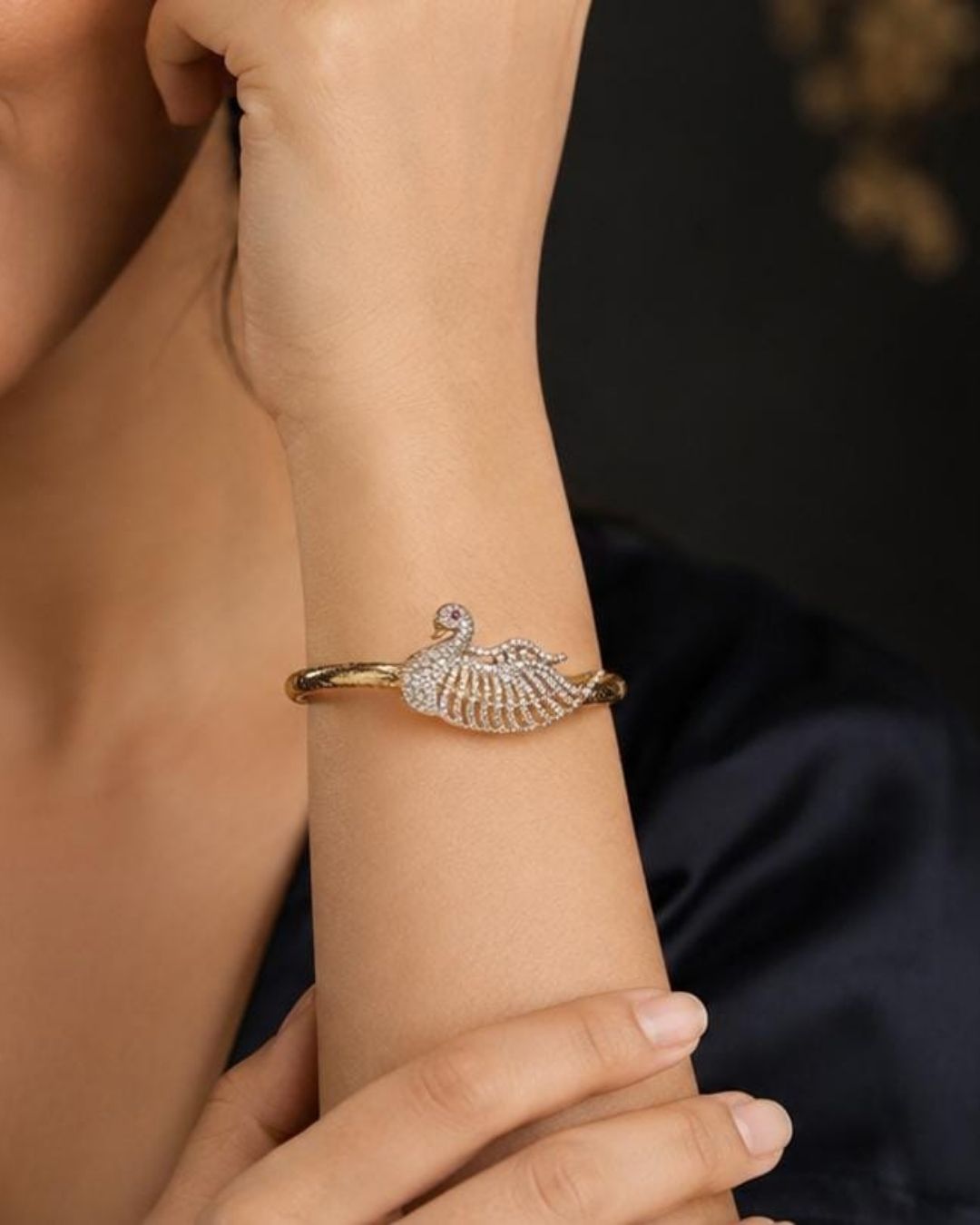 Beautiful gold plated designer kada pair featuring intricate interwoven knot-inspired motifs highlighted with sparkling CZ stones. Perfect for festive occasions, traditional wear, parties, celebrations, and gifting.