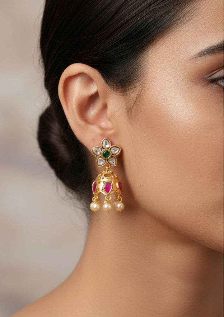 Close view of a south indian women ear wearing Jadau Kundan Screwback Gold Plated Daily Wear Jhumkas with shine and good lookingand used for  daily ware , functional , festivals and giffting