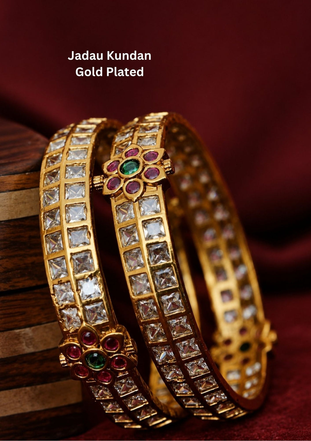 Designer Jadau Kundan bangles with brilliant square zircon stones, ruby and emerald floral centerpiece, perfect for festive and wedding wear.