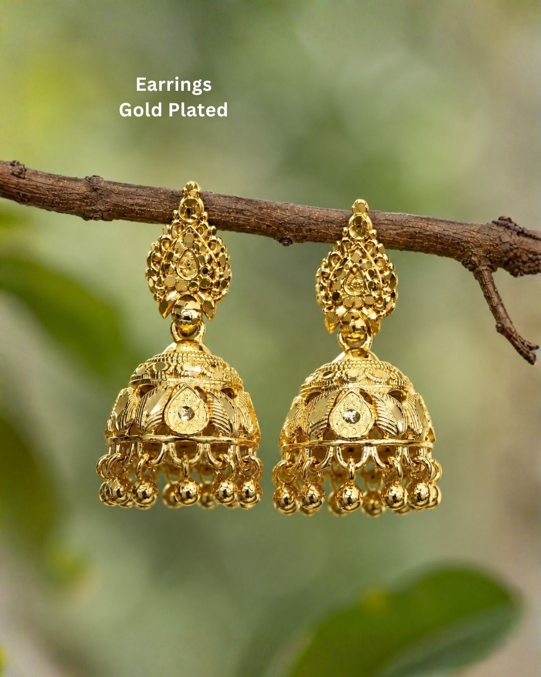 Premium gold plated traditional jhumka earrings featuring intricate ethnic craftsmanship, ornate dome-shaped designs, floral detailing, and elegant hanging gold bead accents. Perfect for sarees, festive occasions, weddings, classical dance performances, and traditional events.