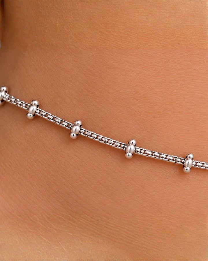 Beautiful silver plated chain anklet set featuring delicate textured chains, polished silver beads, and decorative hanging charms. Perfect for traditional occasions, festive wear, daily wear, and gifting.