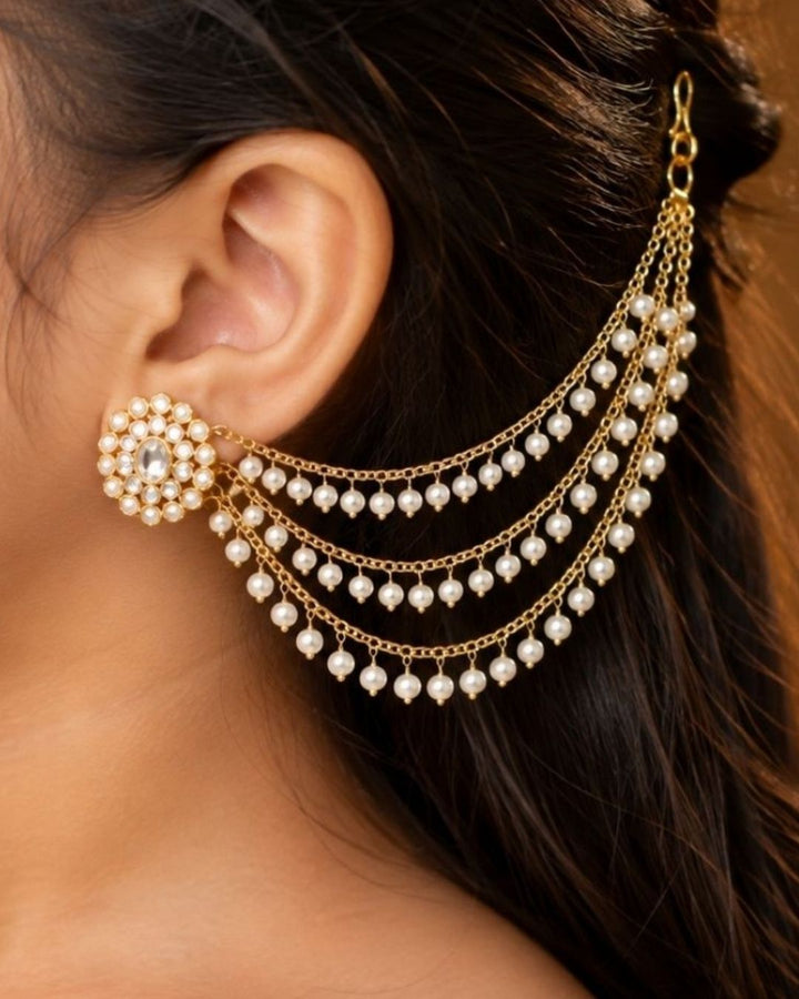 Gold-plated multi-strand chain ear chains decorated with small white pearl-like beads, displayed on a dark navy blue background with the text &