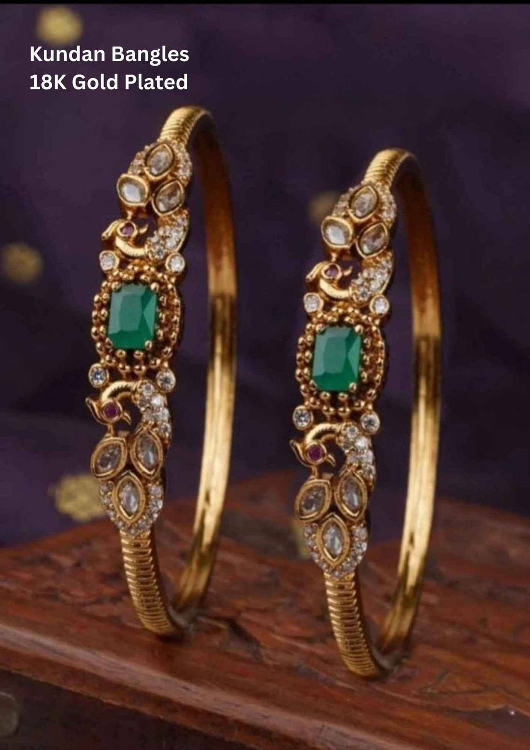 Gold-plated kundan bangles with green stones