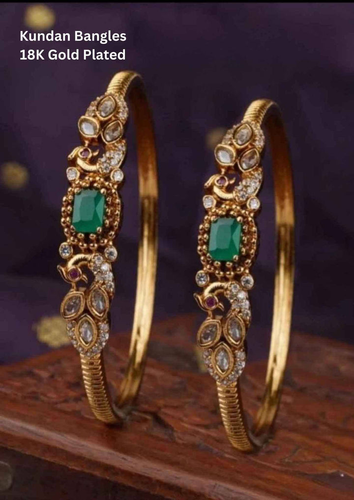 Gold-plated kundan bangles with green stones