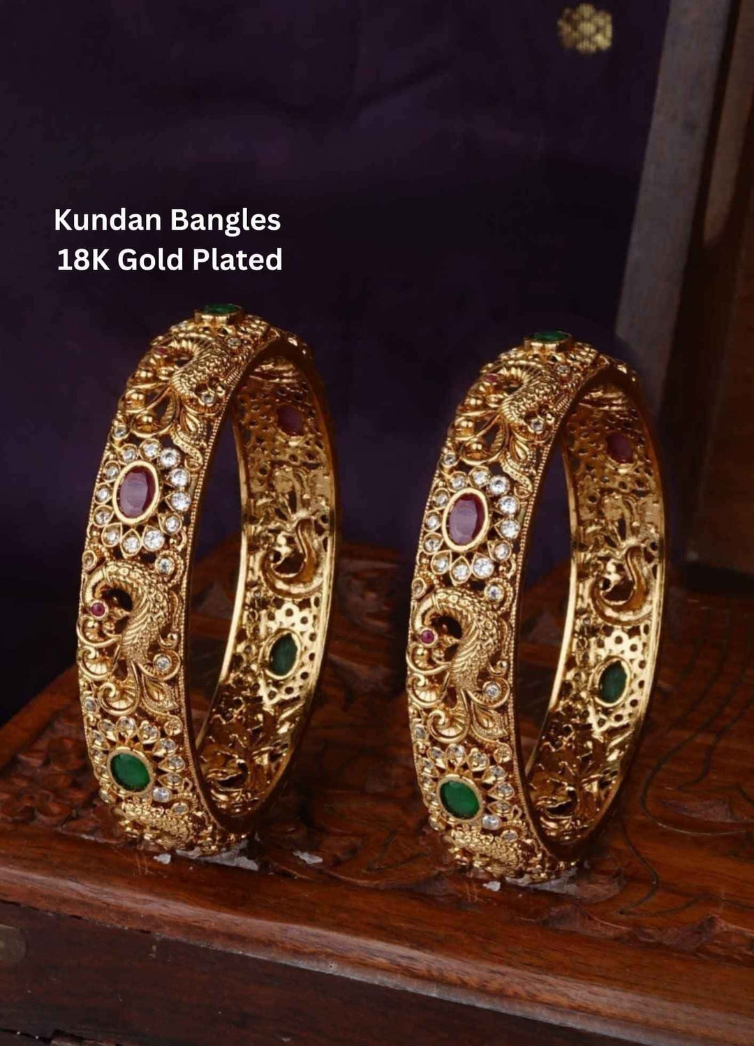 Two gold Kundan bangles with gemstones