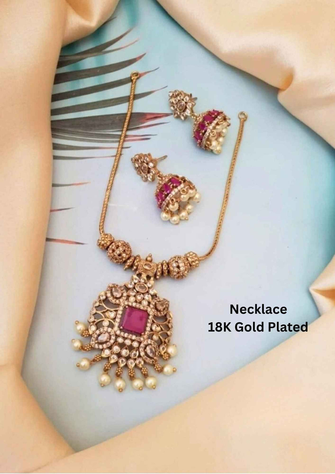 Gold-plated necklace with pink gemstones