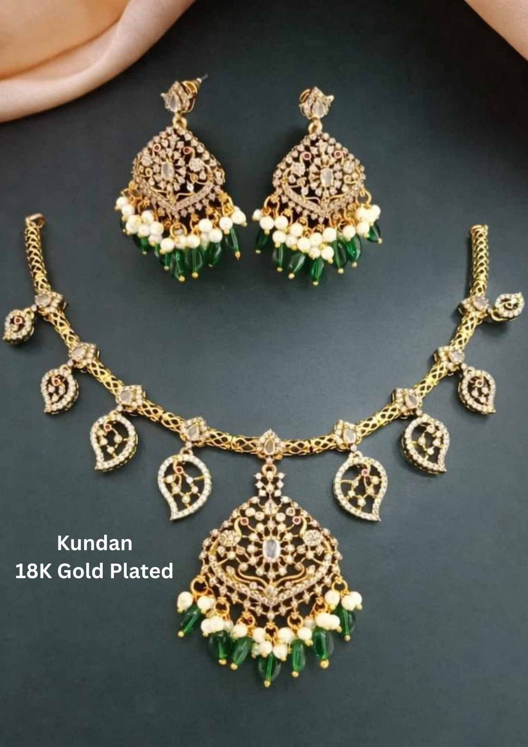 Gold-plated necklace and earrings set with green stones 