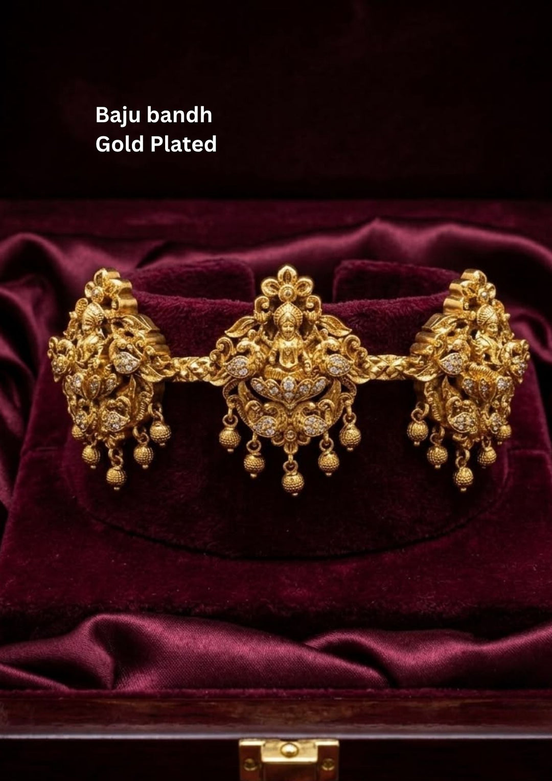 Beautiful traditional gold plated Baju Bandh showcasing intricate Lakshmi temple craftsmanship with sparkling zircon detailing and hanging beads. Perfect for bridal wear, weddings, classical dance, and festive celebrations.