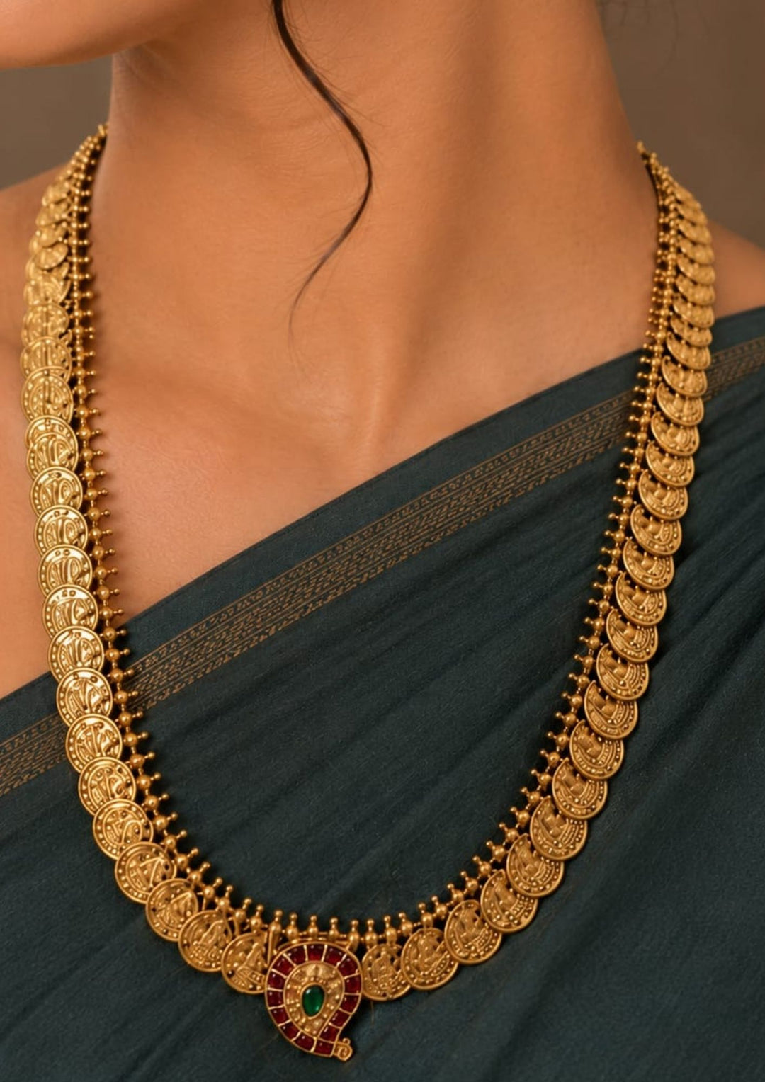 Traditional South Indian antique gold plated Laxmi Kasulaperu haram necklace set designed with structured gold coin arrays, ruby accents, and an elegant matte gold finish that gives a graceful traditional look for festive celebrations, poojas, family functions, and bridal outfits with lightweight comfortable use