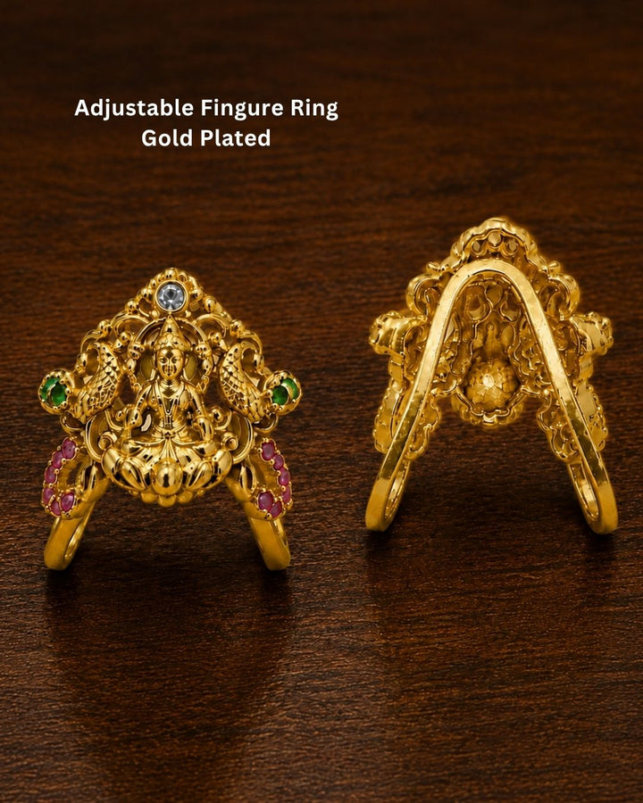 Beautiful Lakshmi Devi gold plated earrings featuring an intricate goddess design, green and ruby-colored stones, and detailed traditional craftsmanship. Perfect for festive occasions, temple visits, traditional outfits, and gifting.