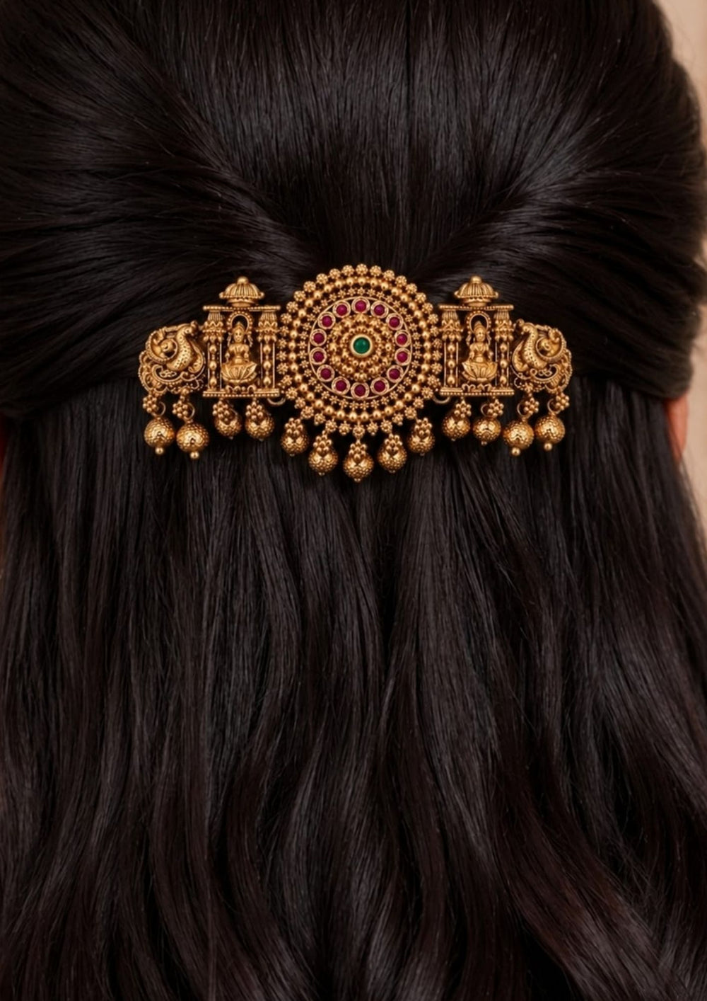 South indian women's Gold plated Laxmi hair clip with antique finish, designed with Lord Lakshmi in sitting in a temple, peacocks, circle designed by ruby pink and green stone with hanging gold bead drops in South Indian temple jewelry pattern perfect for bridal hairstyles, Bharatanatyam, weddings, festivals, poojas, sarees, lehengas, and traditional ethnic hair styling with rich royal appearance.