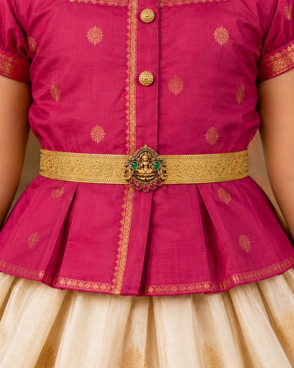 Beautiful gold plated kid’s hip belt featuring a wide engraved band with a traditional Lakshmi centerpiece decorated with ruby and green stones. Perfect for traditional wear, weddings, festive occasions, cultural events, parties, and gifting.