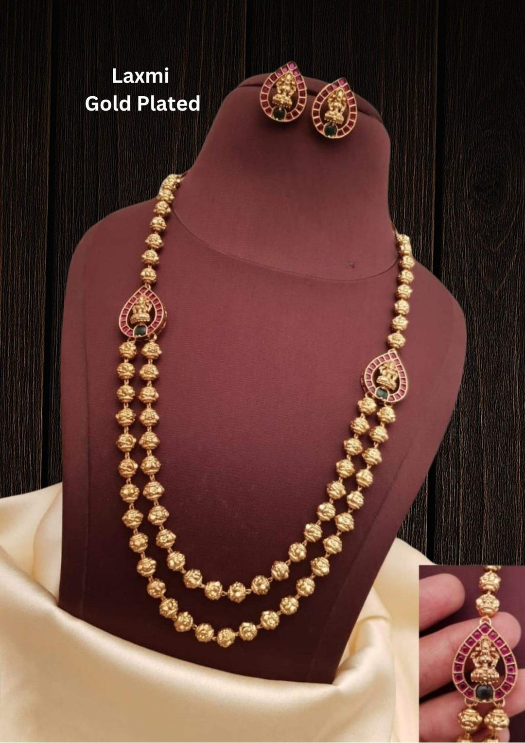 jadau kundan gold plated traditional double layer beads necklace set and in given picture laxmi pendent shows it very clear and it comes with laxmi earrings it is light weight and most south Indian women's use temple jewelry   