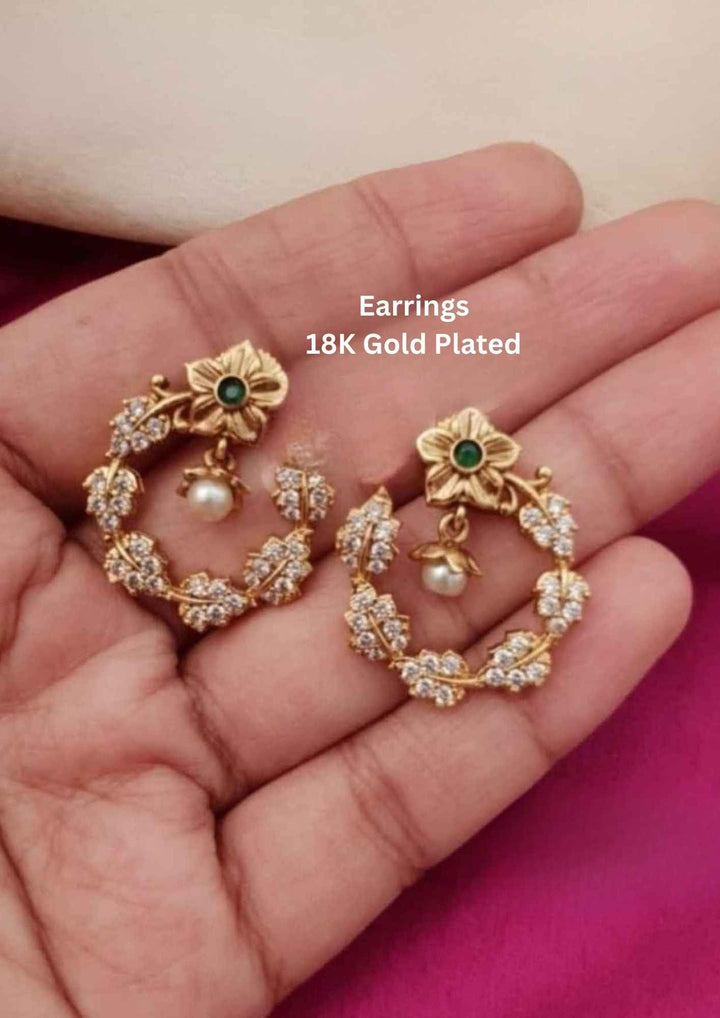 Gold-plated earrings with green gemstones