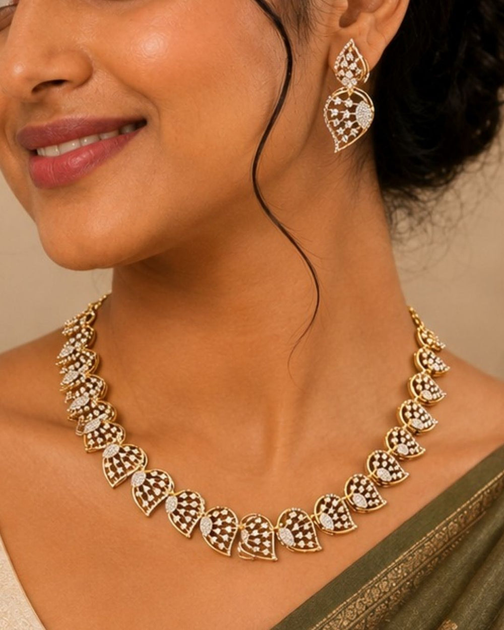 Gold plated jewelry set  featuring a delicate choker necklace made of repeating, stylized leaf or paisley-shaped links. Each openwork link is encrusted with brilliant, clear white Zirconian diamonds (American Diamonds) that catch the light beautifully. Includes a matching pair of elegant hanging earrings mimicking the exact leaf pattern. Crafted for festive occasions and parties with premium quality and Cash on Delivery available.